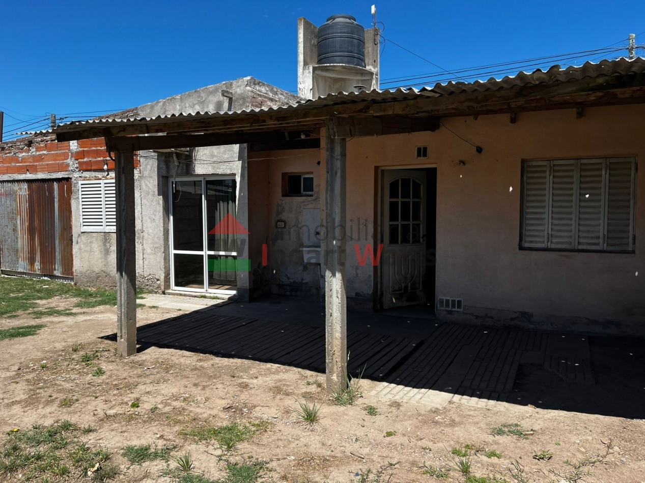 CASA DE BARRIO CON AMPLIACION